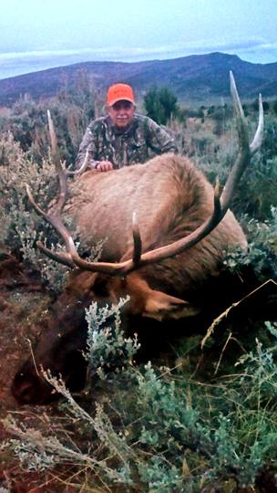 Hunter and his elk.jpg